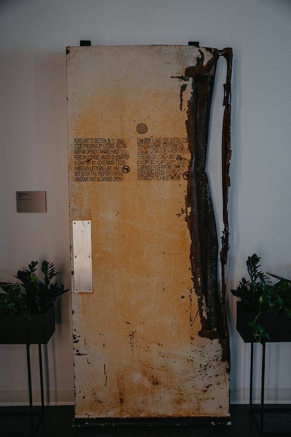 The breached back door from the Congregation Beth Israel synagogue in Colleyville, Texas, on display at the Secure Community Network’s headquarters. Credit: Jamie Kelter Davis for The New York Times
